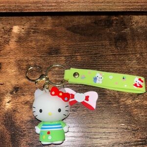 NWOT Hello Kitty Keychain with Green Outfit and Red Bow